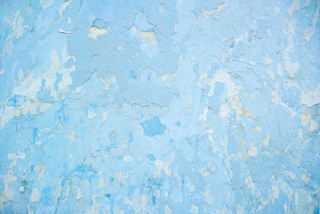Close-up photo of the blue rough stucco wall texture