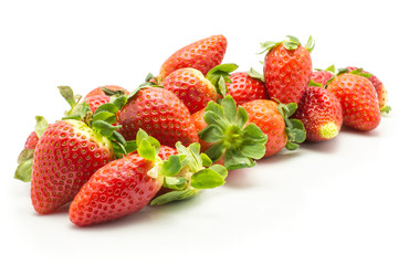 Fresh strawberries heap isolated on white background.