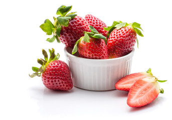 Garden strawberries in a ceramic isolated on white background ideal breakfast.