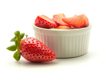 Garden strawberries in a cream isolated on white background ideal breakfast.