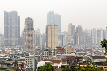 Fototapeta na wymiar Macau city center panorama with poor slums blocks and tall living buildings, China