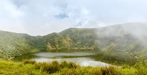 Foto auf Acrylglas Lake inside Bisoke volcano crater, Virunga volcano national park, Rwanda © vadim.nefedov