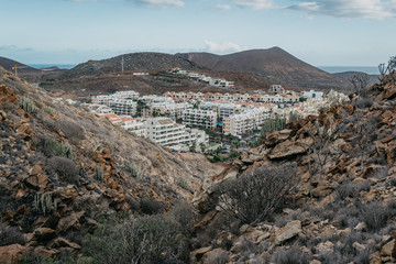 View of the town Palm Mar between two rocks