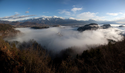 amazing view over lake Bled on a foggy morning from Ojstrica viewpoint, Slovenia, Europe - travel background