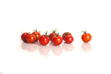 Isolated fresh red and orange cherry tomatoes