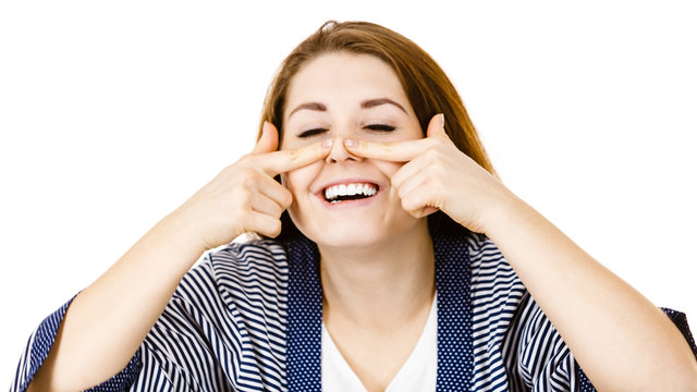 Happy Cheerful Woman Touching Her Nose
