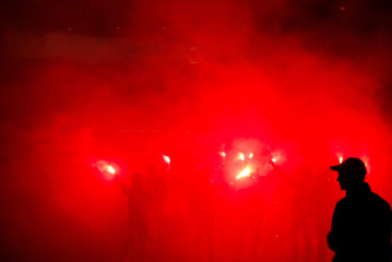 football fans lit up the lights and smoke bombs. revolution. protest