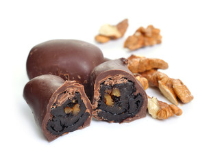 Homemade Candies with dried plum and nuts. Isolated on white background