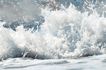 Big wave on the sea  with a lot of foam. fake color. Copy space. Concept of travel