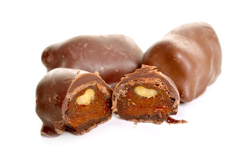 Homemade Candies with dried apricot and nuts. Isolated on white background