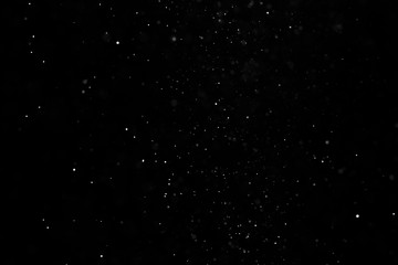 The texture of the snow on a black background