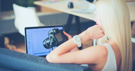 Young photographer and graphic designer at work