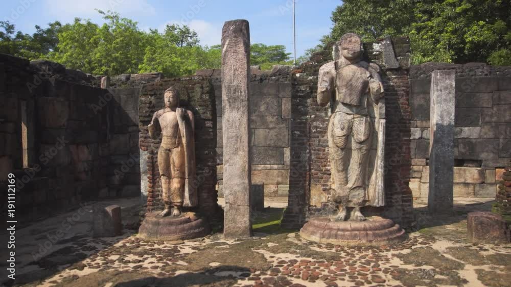 Wall mural ancient religious sculptures at sri lankan palace complex ruins