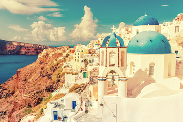 Santorini city landscape of luxury travel destination. Cruise tourist popular attraction in Europe for summer holidays. Beautiful scenery of old town with white houses and three domes blue church.