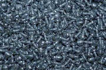 Pile of galvanized metal steel countersunk head screws