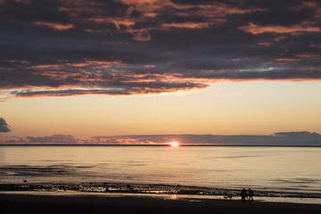 Cumbrian sunset with silhouettes of people