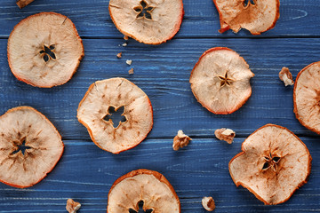 Tasty apple chips on wooden background, top view © Africa Studio