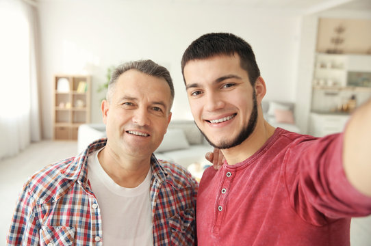 Young man and his dad at home