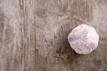 Fresh garlic on wooden background