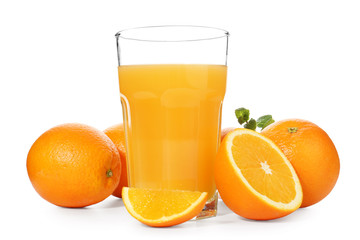 Glass of fresh orange juice with fruit on white background