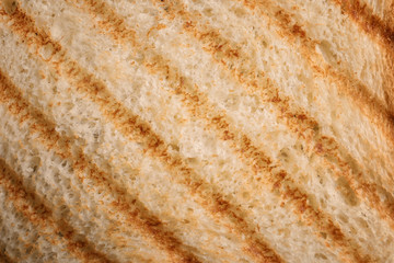 Tasty toasted bread as background