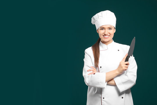 Beautiful female chef with knife on color background