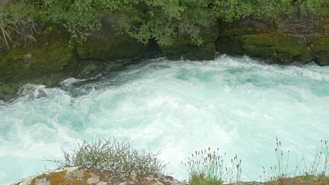 Rough river rapids in the Wailato River on the North Island of New Zealand.