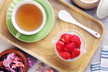 Delicious dessert panna cotta with strawberrieson wooden background
