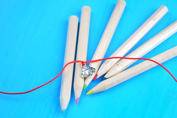 Colored pencils on blue background