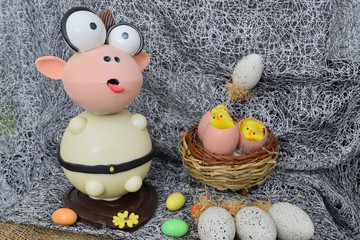 chocolate egg in the shape of a lamb with various decorations