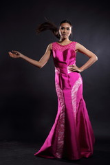 Fototapeta premium Asian woman in evening long ball dress