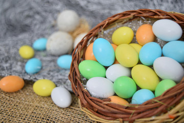 chocolate eggs of various colors with decorations