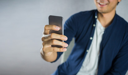 Man using phone, and smiling