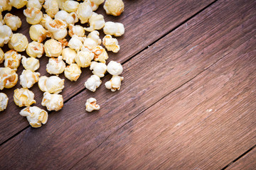popcorn texture on a wooden table blackground