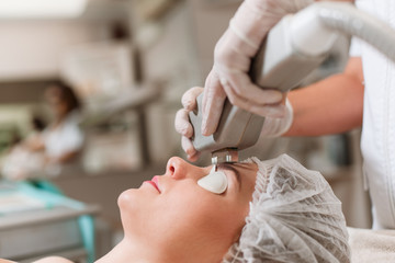 Young woman receiving laser treatment