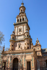 Fototapeta na wymiar The stunning Tower on Plaza de Espana, in Seville, Spain captured on a warm spring afternoon