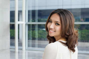 Fototapeta na wymiar happy smiling positive asian caucasian business woman portrait