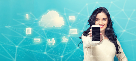 Cloud Computing with young woman holding out a smartphone in her hand