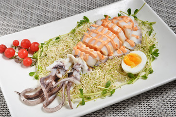 Squid salad with egg, alfalfa sprouts and sauce 