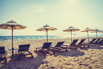 Umbrella and chair on the beach and sea