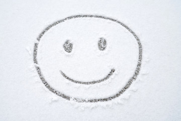 Smile face on the snow in winter after snow