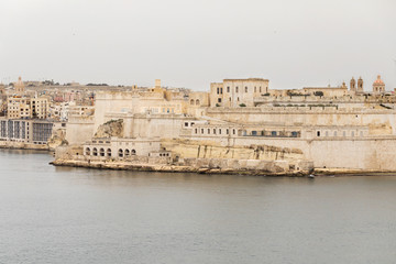 Saint Angelo castle and surroundings seen from Lower Barrakka Gardens, Valletta, Malta
