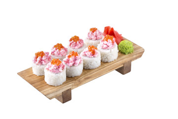Sushi set on a wooden board on a white background.Isolated.