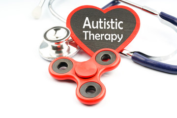 Fidget spinner with autistic therapy concept