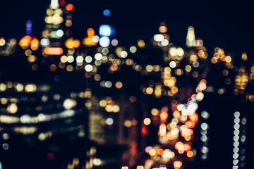 Gordijnen Night New York City Midtown skysrapers in bokeh blur © Nick Starichenko