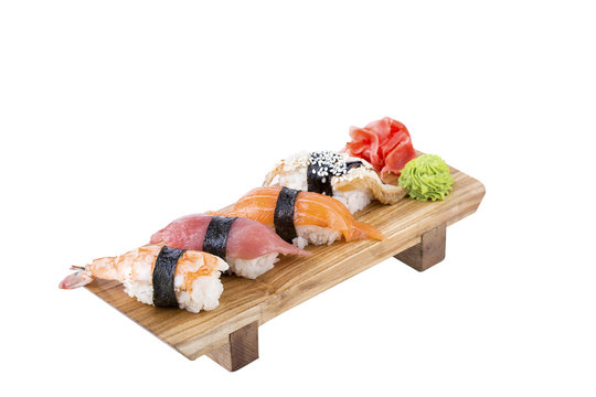 Sushi set on a wooden board on a white background.Isolated.