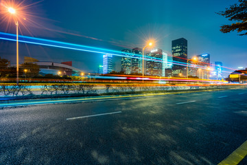 light trails in the downtown district, china.