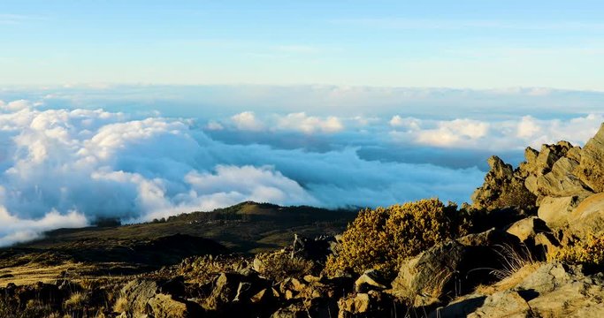 timelapse of sunset above the clouds on the slopes of haleakala in muai hawaii