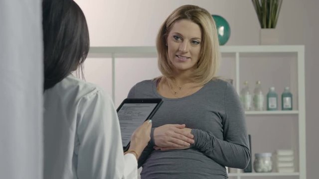 Female patient receiving advice from female health professional