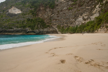Tropical beach with turquoise water among the rocks, Karang Dawa, Nusa Penida Island, Bali, Indonesia. Travel concept.